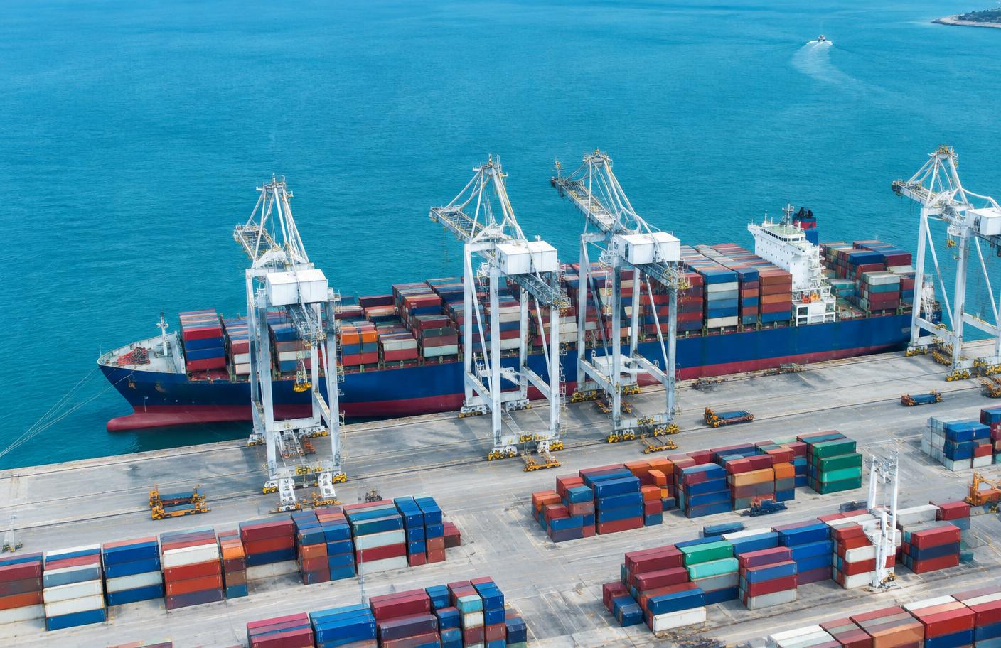 Container ship and cargo cranes at an international port